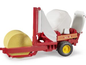 Ballenwickler mit ockerbraunem und weißen Rundballen